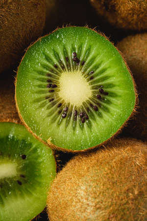 Kiwi fruit half sliced close up macro, healthy lifestyle and food, vibrant green colorの写真素材