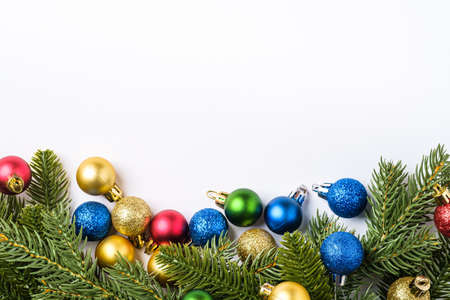 Christmas composition with copy space. Colorful ornament, baubles and fir needles decorations, top viewの写真素材