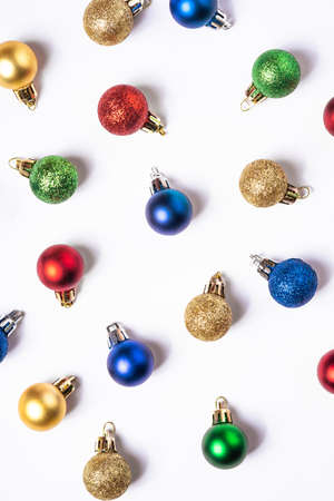 Christmas composition with colorful balls and ornaments decorations on white backgroundの写真素材