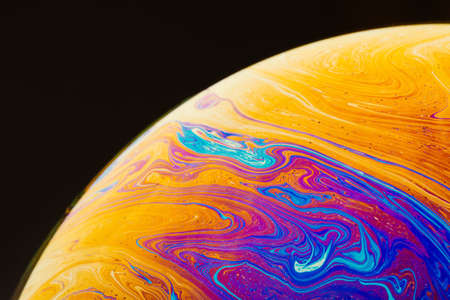 Fluid art made of colorful soap bubble film. Trendy Inkscape blurred background. Alien space planets...