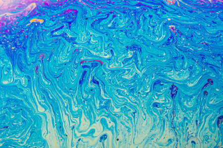 Fluid art made of colorful soap bubble film. Trendy Inkscape blurred background. Alien space planets...