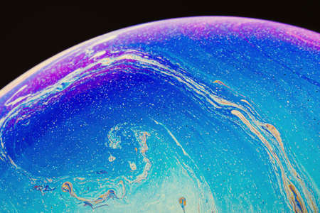 Fluid art made of colorful soap bubble film. Trendy Inkscape blurred background. Alien space planets...