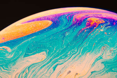 Fluid art made of colorful soap bubble film. Trendy Inkscape blurred background. Alien space planets...