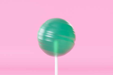 Green lollipop sweet candy on stick, pastel pink background, 3d renderingの写真素材