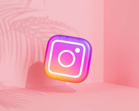 Melitopol, Ukraine - June 01 2021:  Instagram logo icon, photography social media app, pink background with tropical leaves shadows, 3d renderのeditorial素材