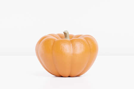 Pumpkin on white background for advertising on autumn holidays or sales, 3d renderの写真素材