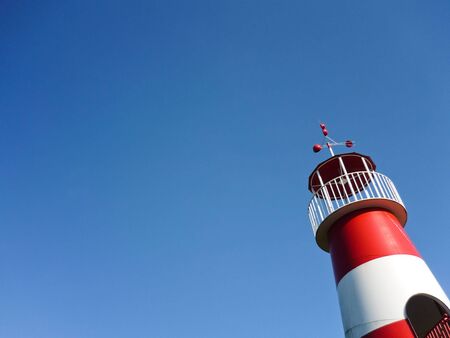 Red and white lighthouseの写真素材