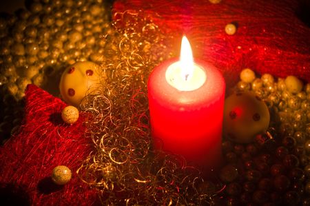 Red candle with christmas decorationの写真素材