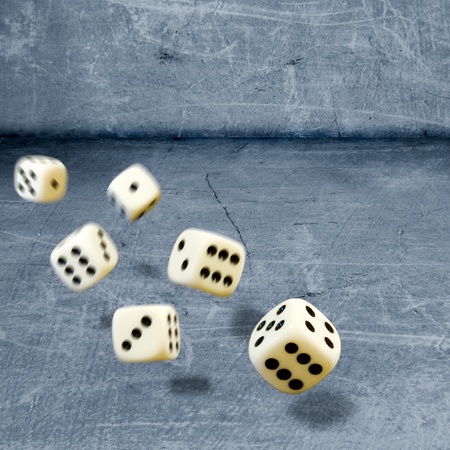 Throwing six dices on a stone floorの写真素材
