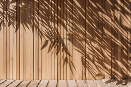 Tropical bamboo tree leaf shadow on a wooden panel with wood grain. Background for luxury product display and interior design. 3D rendering.の写真素材