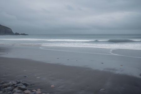 NZ, south island west coast, gray sky over the sea setting over the horizon at the beach, dusk, muted pastel colors.の写真素材