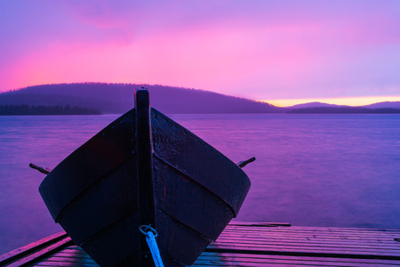 Wooden boat in colorful summer nightの写真素材