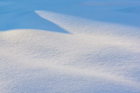 Sharp shadow on snowの写真素材