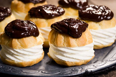 Chocolate Ganache Covered Creampuffs or Profiteroles on Metal Tray