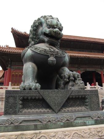 One of the stone lions guarding the entrance of the forbidden city in Beijingの写真素材