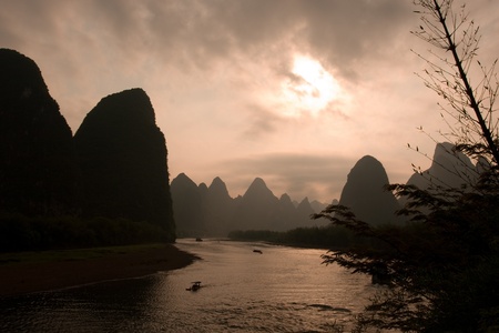 Mountains and river at sunset in Yangshuo, Chinaの写真素材