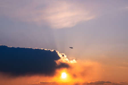 Awacs Plane at the Sunset with sun behind cloud, Chateauroux, Franceの写真素材