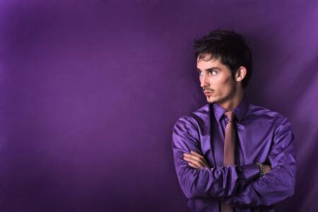 Horizontal close-up portrait of a cheerful young businessman on background with lots of copy space. Photo.の写真素材