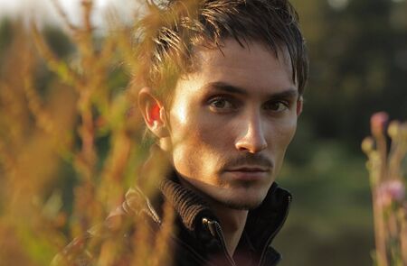  Good looking young man with modern HairStyle. Close-up face. Photo.の写真素材