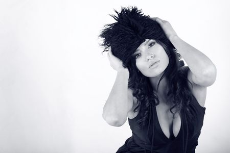 Portrait of a beautiful girl with black hat. Isolated on white. 
の写真素材