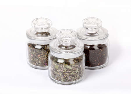 Seasonings and tea in glass vessels isolated on  white backgroundの写真素材