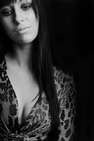 Young sexy girl on leather backgroundの写真素材