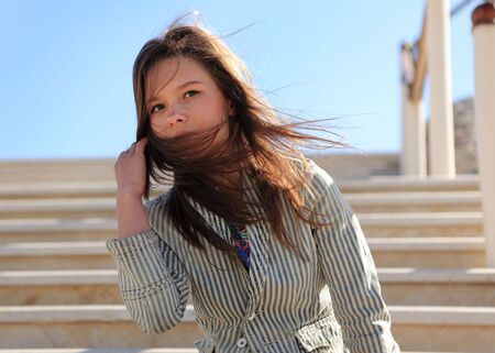 young beautiful girl walks outdoor. photoの写真素材