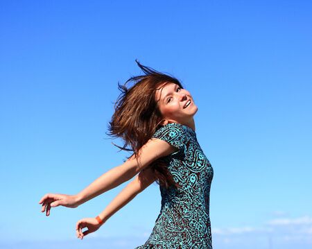 young beautiful girl walks outdoor. photoの写真素材