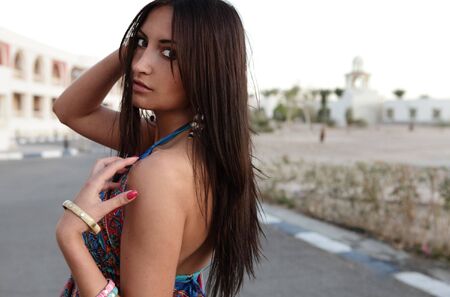 young beautiful girl walks outdoorの写真素材