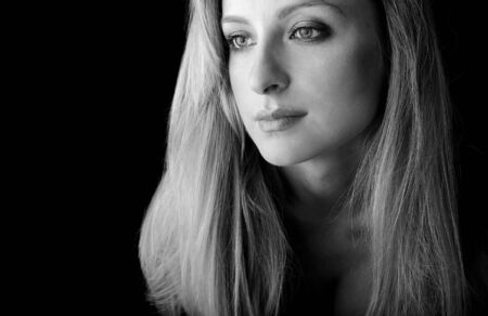 Portrait of attractive young blond girl in sports gloves. Close-up face. 