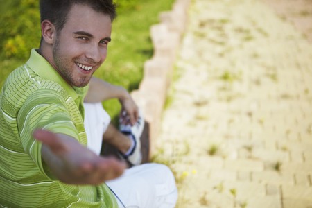 cheerful guy in a green vestの写真素材