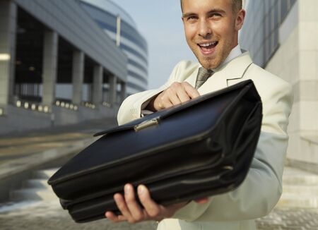 Happy businessman celebrating success, outdoor.の写真素材