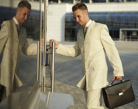 Portrait of businessman in office doorsの写真素材