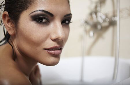 Beautiful latino woman taking bathの写真素材