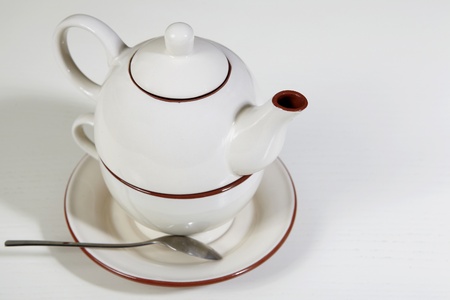 Teapot on white tableの写真素材