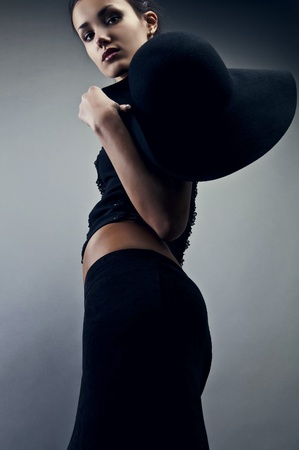 Beautiful woman on black classical dress pose in studio  Vogue style photo  の写真素材