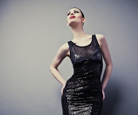 Beautiful woman on black classical dress pose in studio  Vogue style photo  の写真素材