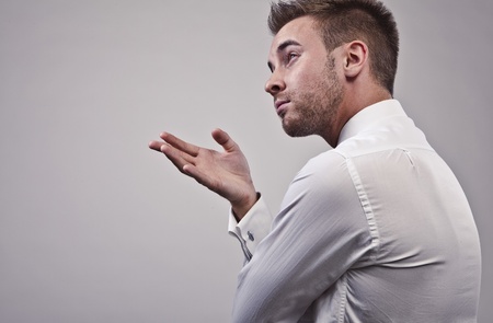 Young handsome businessman talking on mobile phone  の写真素材