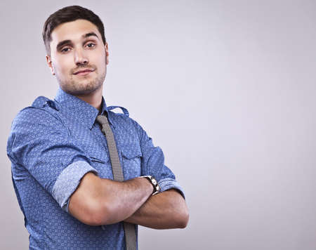 Elegant young handsome man  Studio fashion portrait  の写真素材