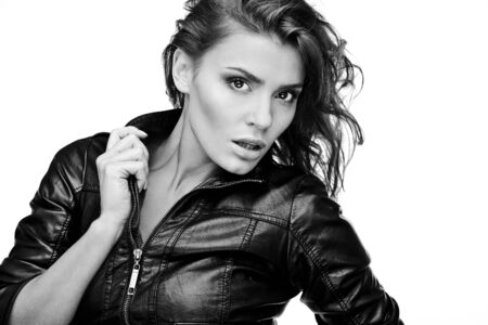 Beautiful young woman on leather jacket  Black-white photo  の写真素材