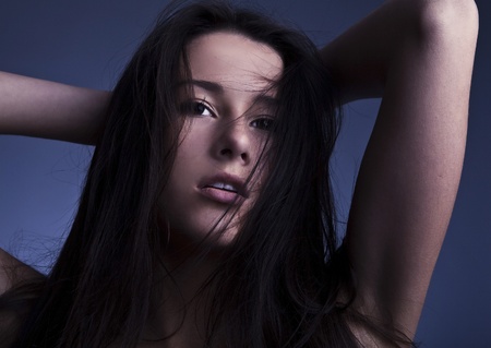 Sensual girl posing  Studio shot on gray background  の写真素材