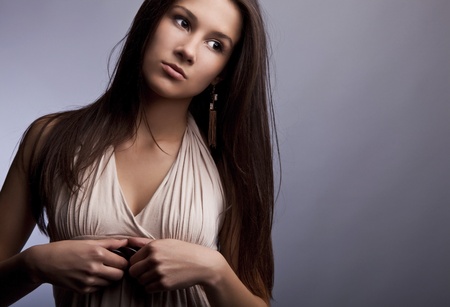 Sensual girl posing  Studio shot on gray background  の写真素材