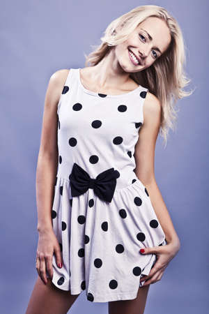 Fashionable blond girl smiling  の写真素材