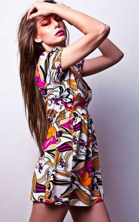 Beautiful young female face with bright fashion multicolored make-up  の写真素材