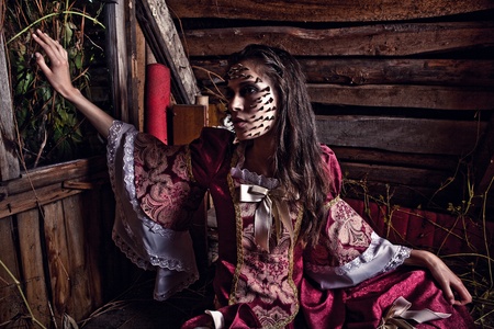 
 a young fashion lady in a dark mystic location  の写真素材