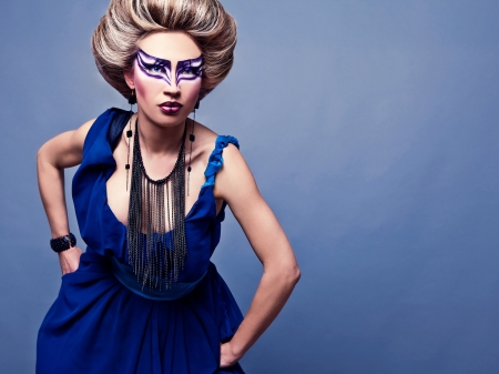 Beautiful young female face with bright fashion multicolored make-up の写真素材