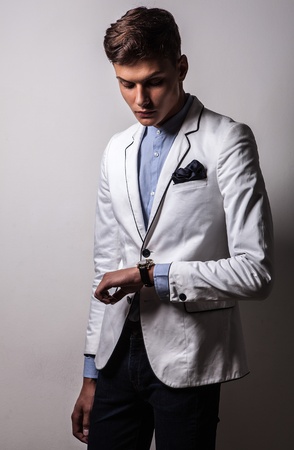 Elegant young handsome man  Studio fashion portrait  の写真素材