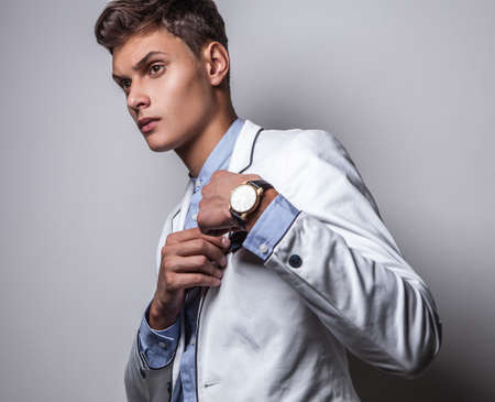 Elegant young handsome man  Studio fashion portrait  の写真素材