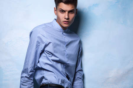 Elegant young handsome man on grunge background  Studio fashion portrait  の写真素材