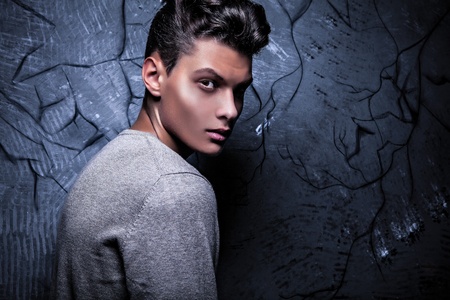Elegant young handsome man on grunge background  Studio fashion portrait  の写真素材